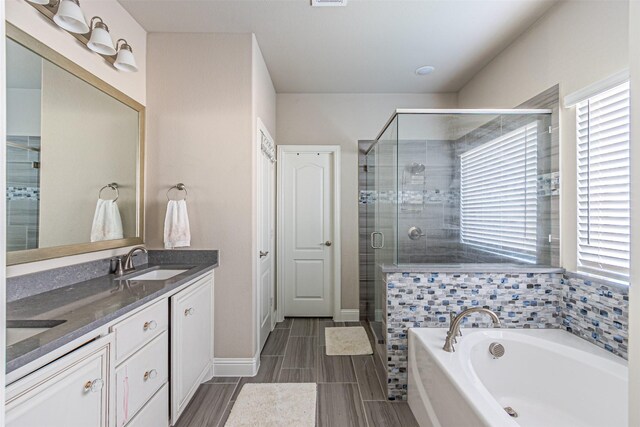 3001 Spring Ct, Midlothian, TX 76065 - full bath with healthy amount of natural light, a shower stall, double vanity, and a bath