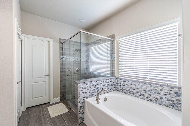 3001 Spring Ct, Midlothian, TX 76065 - bathroom with a bath, plenty of natural light, and a shower stall
