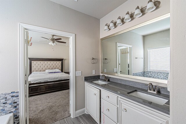 3001 Spring Ct, Midlothian, TX 76065 - ensuite bathroom featuring double vanity, ceiling fan, and wood finished floors