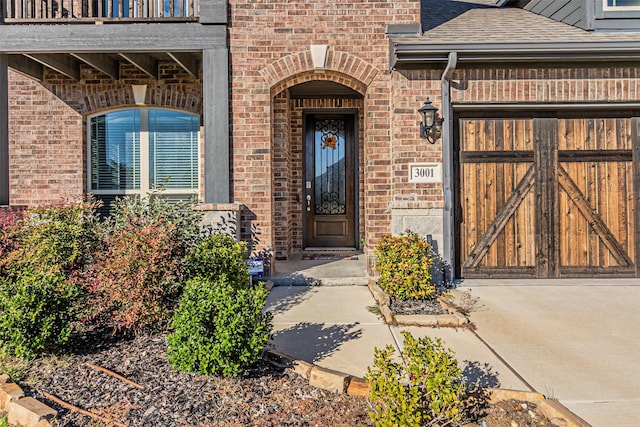 3001 Spring Ct, Midlothian, TX 76065 - view of exterior entry featuring brick siding, roof with shingles, and a balcony