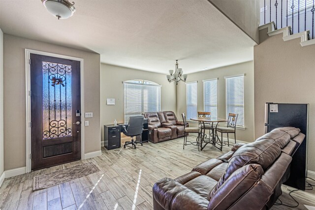 3001 Spring Ct, Midlothian, TX 76065 - entrance foyer with a chandelier, wood finished floors, and baseboards