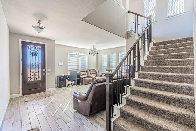 3001 Spring Ct, Midlothian, TX 76065 - foyer with stairs, wood tiled floors, and baseboards