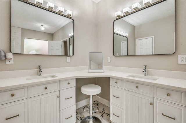 11016 Huntington Rd, Frisco, TX 75035 - full bath featuring marble look tile flooring, vanity, and baseboards