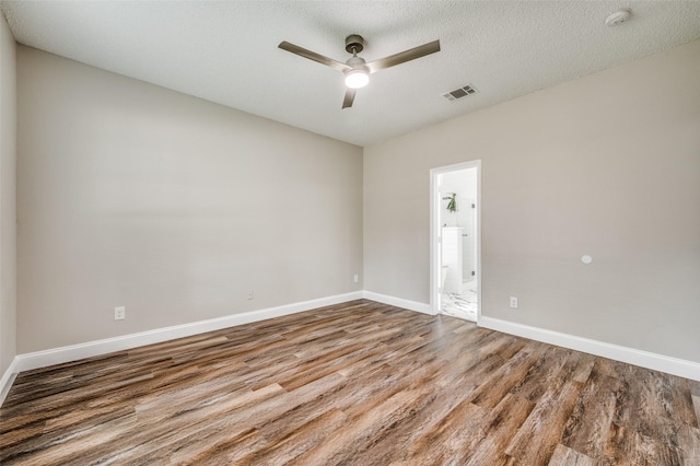 11016 Huntington Rd, Frisco, TX 75035 - empty room featuring wood finished floors, a smoke detector, ceiling fan, baseboards, and a textured ceiling