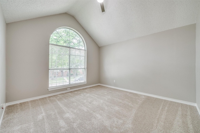 11016 Huntington Rd, Frisco, TX 75035 - carpeted spare room with vaulted ceiling, ceiling fan, a textured ceiling, and baseboards