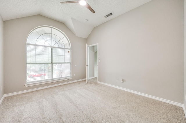 11016 Huntington Rd, Frisco, TX 75035 - carpeted empty room featuring a textured ceiling, ceiling fan, vaulted ceiling, and baseboards