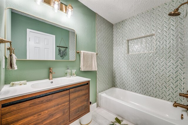 11016 Huntington Rd, Frisco, TX 75035 - bathroom featuring a textured ceiling, vanity, and bathtub / shower combination