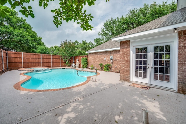 11016 Huntington Rd, Frisco, TX 75035 - view of pool with french doors, a patio area, a fenced backyard, and a pool with connected hot tub