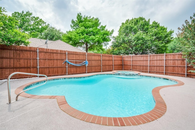 11016 Huntington Rd, Frisco, TX 75035 - view of swimming pool with fence and a pool with connected hot tub