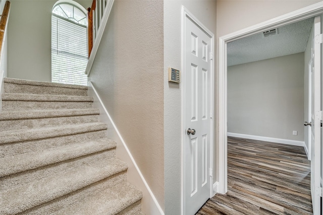 11016 Huntington Rd, Frisco, TX 75035 - stairway featuring wood finished floors and baseboards