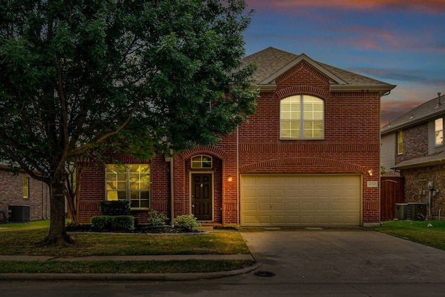 10317 Colfax Dr, Mckinney, TX 75072 - traditional home featuring brick siding, central AC unit, and an attached garage