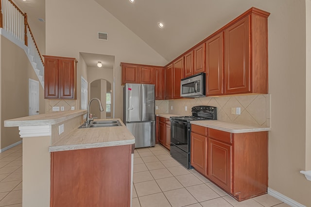 10317 Colfax Dr, Mckinney, TX 75072 - kitchen with appliances with stainless steel finishes, a sink, light tile patterned floors, light countertops, and backsplash