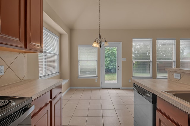 10317 Colfax Dr, Mckinney, TX 75072 - kitchen featuring stainless steel dishwasher, healthy amount of natural light, a chandelier, and baseboards