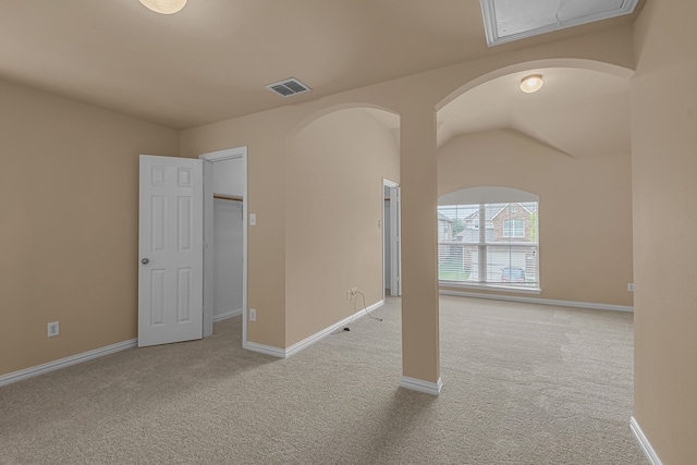 10317 Colfax Dr, Mckinney, TX 75072 - empty room with carpet flooring, baseboards, and arched walkways