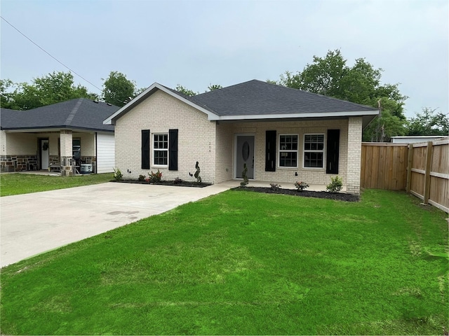 206 E Birch St, Campbell, TX 75422 - ranch-style house with brick siding, covered porch, and a shingled roof