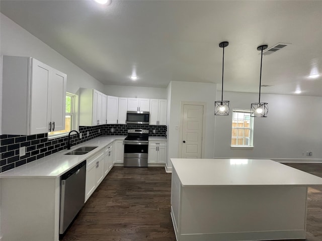 206 E Birch St, Campbell, TX 75422 - kitchen featuring stainless steel appliances, a sink, dark wood-style flooring, and healthy amount of natural light