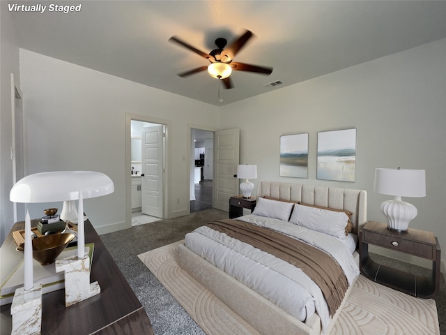 206 E Birch St, Campbell, TX 75422 - bedroom with carpet floors, baseboards, connected bathroom, and a ceiling fan