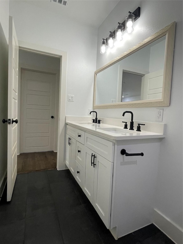 206 E Birch St, Campbell, TX 75422 - bathroom with double vanity and tile patterned flooring