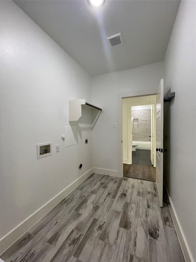 206 E Birch St, Campbell, TX 75422 - washroom featuring hookup for an electric dryer, washer hookup, wood finished floors, and baseboards