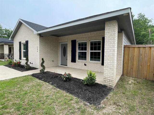 206 E Birch St, Campbell, TX 75422 - ranch-style house featuring brick siding and fence