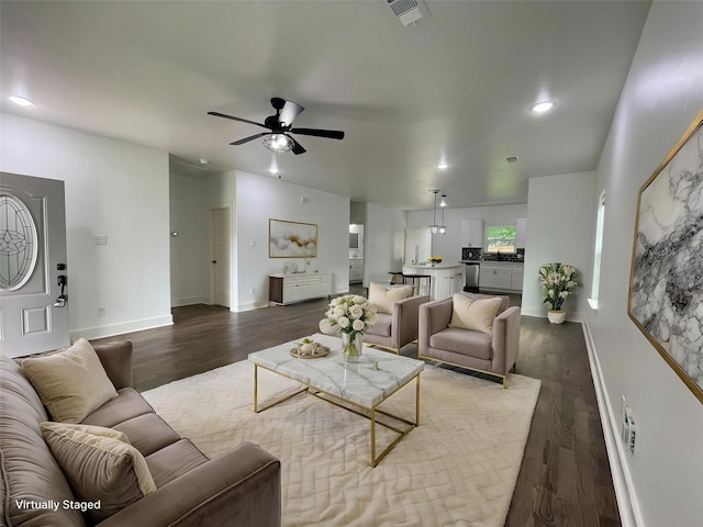 206 E Birch St, Campbell, TX 75422 - living area featuring a ceiling fan, dark wood-style flooring, baseboards, and recessed lighting
