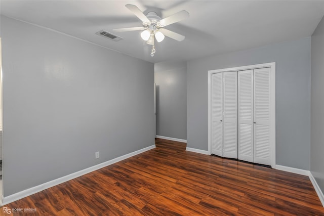 704 Taylor Bend St, Haughton, LA 71037 - unfurnished bedroom featuring baseboards, a closet, dark wood-type flooring, and ceiling fan