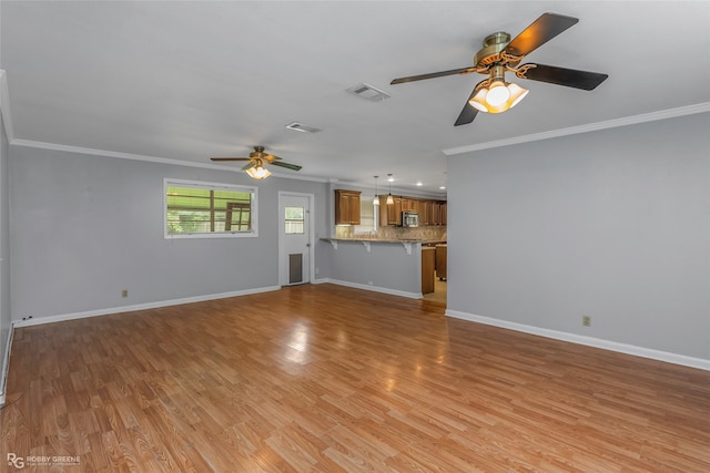 704 Taylor Bend St, Haughton, LA 71037 - unfurnished living room featuring ceiling fan, ornamental molding, light wood finished floors, and baseboards