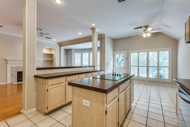 3002 Chukar Dr, Mckinney, TX 75072 - kitchen with ceiling fan, black electric stovetop, decorative columns, dishwasher, and crown molding