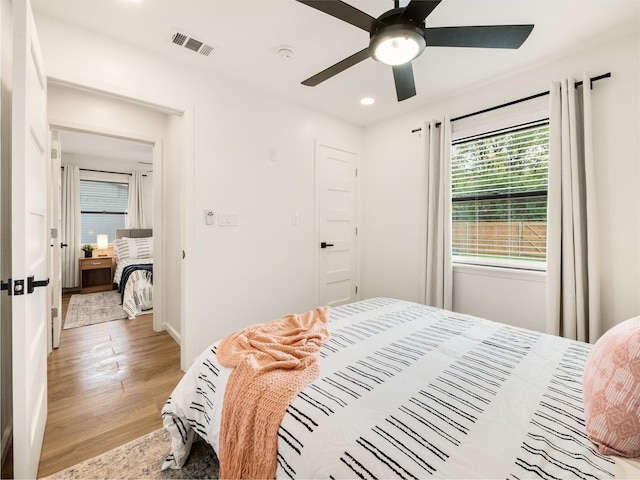 445 Melrose Dr, Richardson, TX 75080 - bedroom featuring light wood-style floors, recessed lighting, ceiling fan, and baseboards