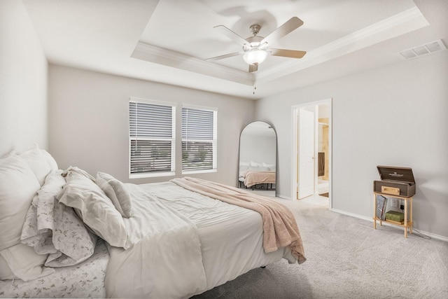 1802 Arcola Ct, Forney, TX 75126 - carpeted bedroom featuring crown molding, a tray ceiling, baseboards, ceiling fan, and ensuite bath