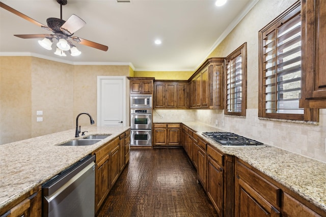 1270 Timber Ln, Frisco, TX 75036 - kitchen featuring a sink, appliances with stainless steel finishes, ceiling fan, light stone counters, and dark wood-style floors