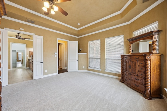 1270 Timber Ln, Frisco, TX 75036 - unfurnished bedroom with carpet flooring, baseboards, a tray ceiling, ornamental molding, and connected bathroom