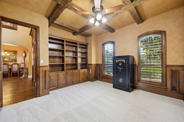 1270 Timber Ln, Frisco, TX 75036 - office space with a wainscoted wall, beamed ceiling, arched walkways, a ceiling fan, and carpet flooring