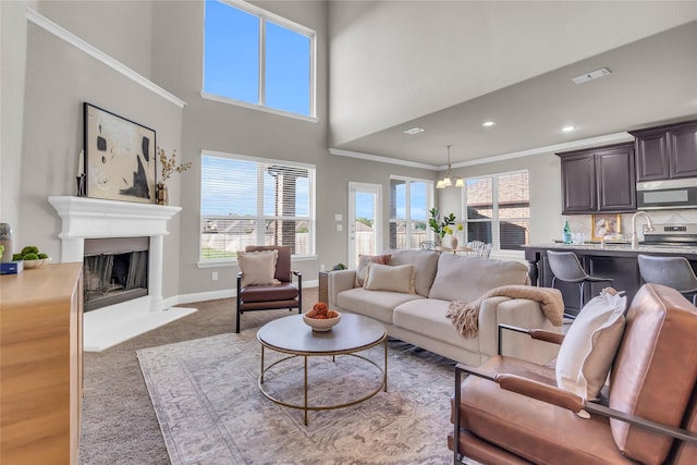 405 Calvert Dr, Midlothian, TX 76065 - living room with a fireplace with raised hearth, healthy amount of natural light, baseboards, carpet floors, and a high ceiling