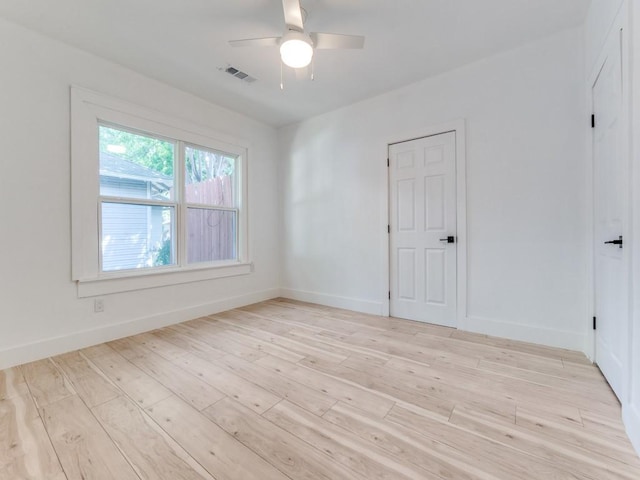 809 Cristler Ave, Dallas, TX 75223 - unfurnished room featuring a ceiling fan, light wood finished floors, and baseboards