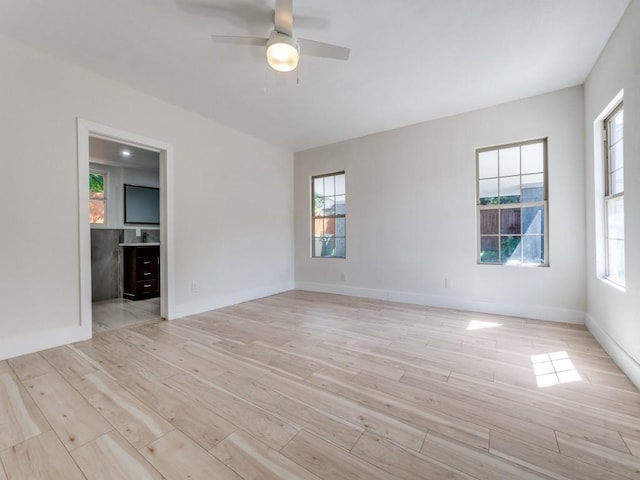 809 Cristler Ave, Dallas, TX 75223 - spare room featuring light wood-type flooring, a ceiling fan, and plenty of natural light