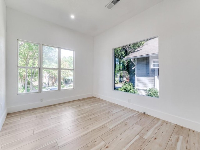 809 Cristler Ave, Dallas, TX 75223 - spare room with baseboards, wood finished floors, and recessed lighting
