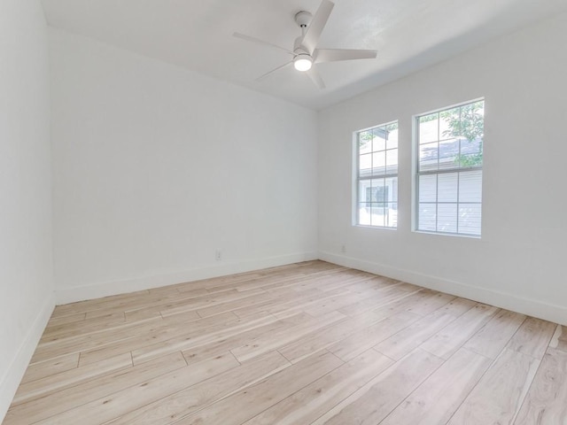 809 Cristler Ave, Dallas, TX 75223 - unfurnished room with light wood finished floors, ceiling fan, and baseboards