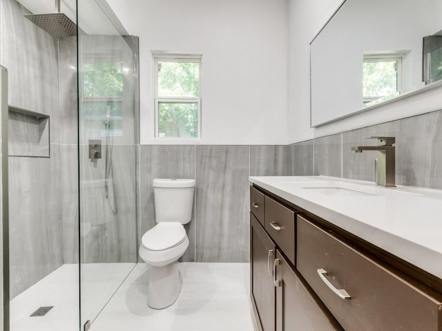 809 Cristler Ave, Dallas, TX 75223 - bathroom featuring tile walls, a shower with door, toilet, healthy amount of natural light, and wainscoting