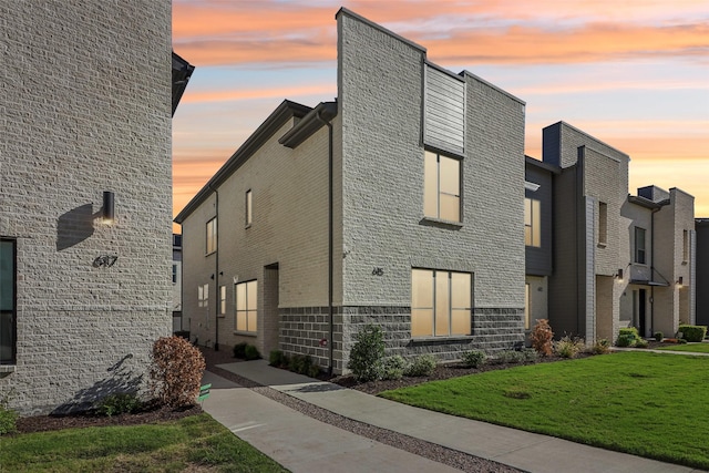 615 Arapaho Dr, Plano, TX 75075 - view of front of property with a front lawn and stone siding