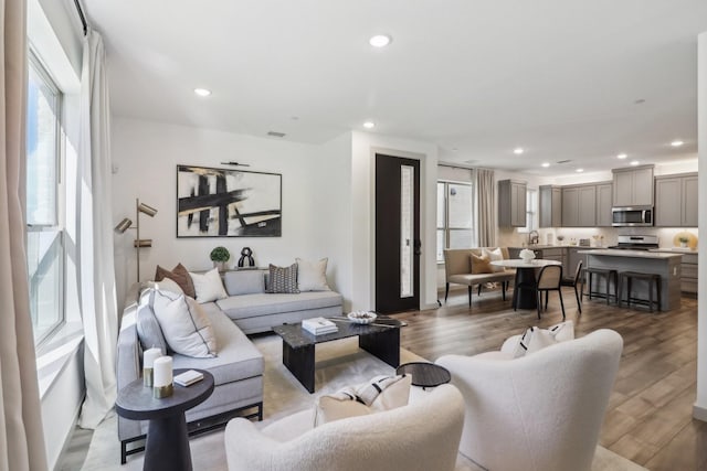 615 Arapaho Dr, Plano, TX 75075 - living room featuring recessed lighting and wood finished floors