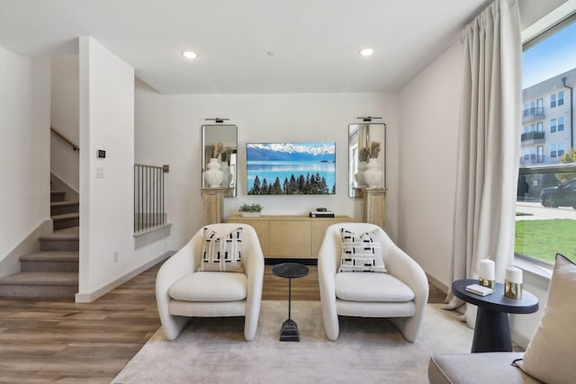 615 Arapaho Dr, Plano, TX 75075 - sitting room featuring wood finished floors, stairs, recessed lighting, and baseboards