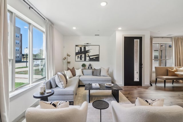 615 Arapaho Dr, Plano, TX 75075 - living area featuring plenty of natural light, wood finished floors, recessed lighting, and baseboards