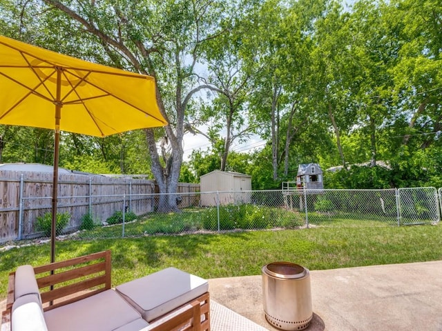 5408 Waltham Ave, Fort Worth, TX 76133 - fenced backyard with a storage unit and a patio area