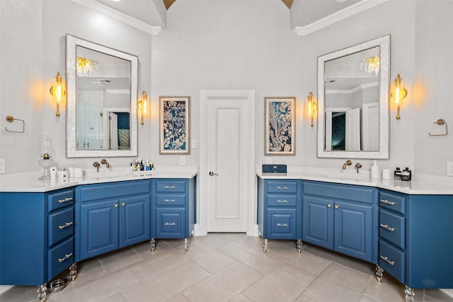 903 Crescent Dr, Highland Village, TX 75077 - bathroom with ornamental molding, tile patterned flooring, two vanities, a shower, and a towering ceiling