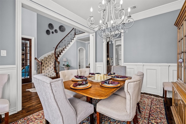 903 Crescent Dr, Highland Village, TX 75077 - dining space with wood finished floors, wainscoting, stairs, a chandelier, and ornamental molding