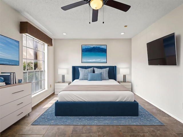 12605 Burninglog Ln, Dallas, TX 75243 - bedroom featuring a textured ceiling, a ceiling fan, and baseboards