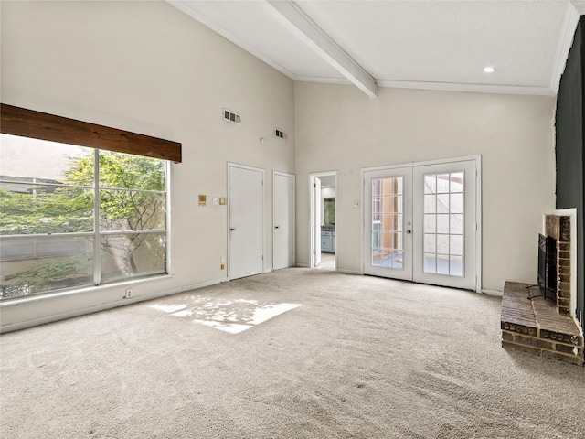 12605 Burninglog Ln, Dallas, TX 75243 - unfurnished living room with plenty of natural light, carpet flooring, beam ceiling, french doors, and high vaulted ceiling