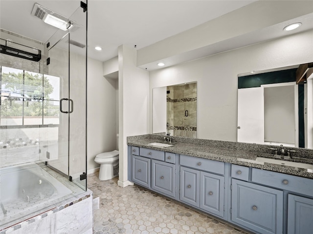 12605 Burninglog Ln, Dallas, TX 75243 - full bath featuring a stall shower, double vanity, a tub with jets, toilet, and recessed lighting