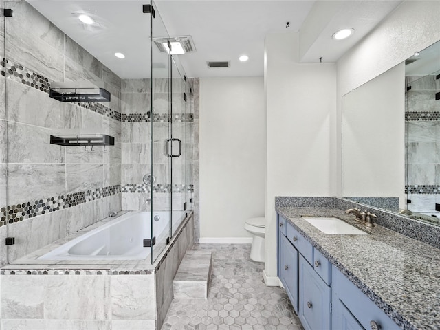 12605 Burninglog Ln, Dallas, TX 75243 - full bath with vanity, toilet, tile patterned floors, recessed lighting, and baseboards